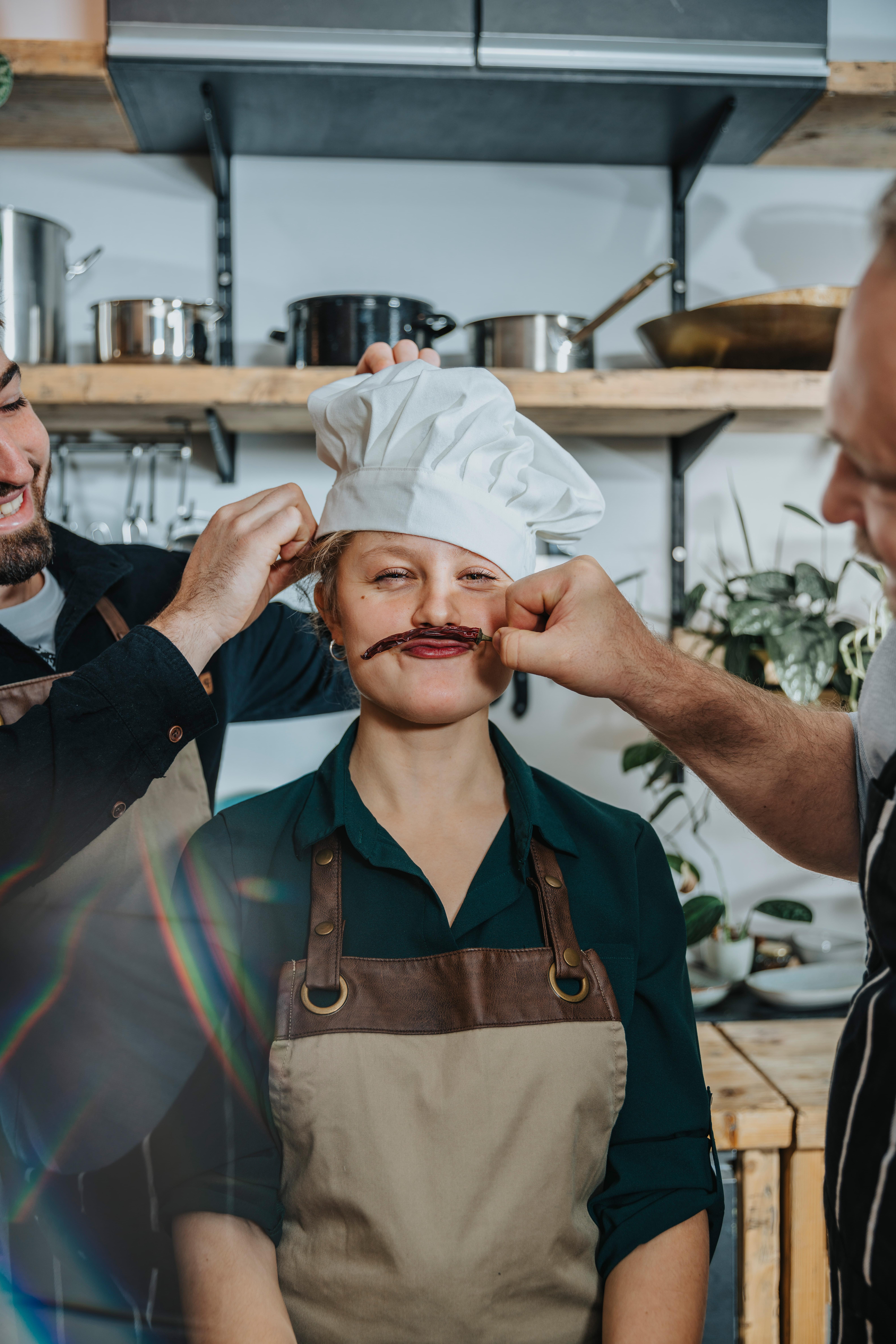 Chefs joking in kitchen, Koeln, NRW, Germany