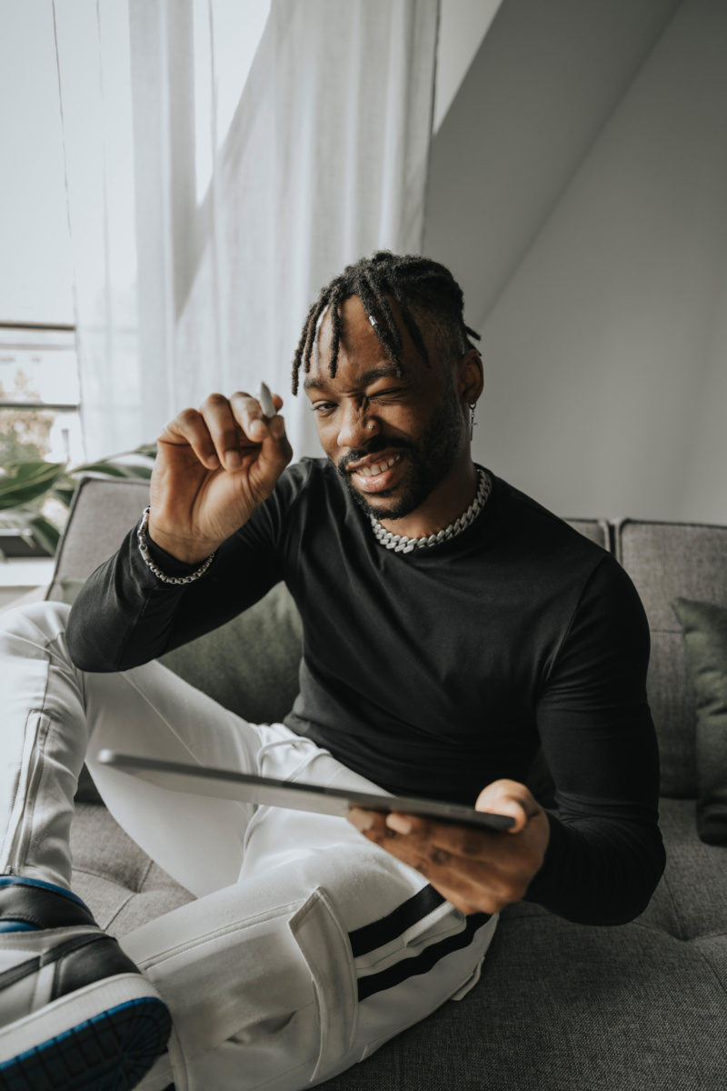 Young man with digital tablet, Cologne, NRW, Germany