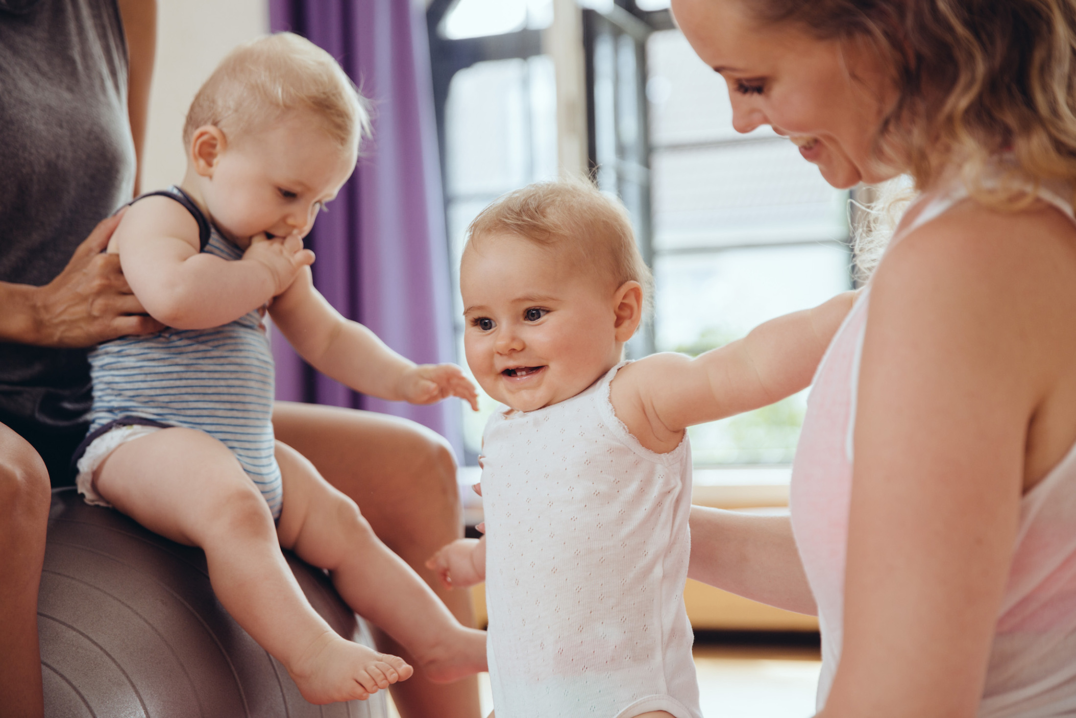 Mothers and babies in exercise room, Cologne, NRW, Germany