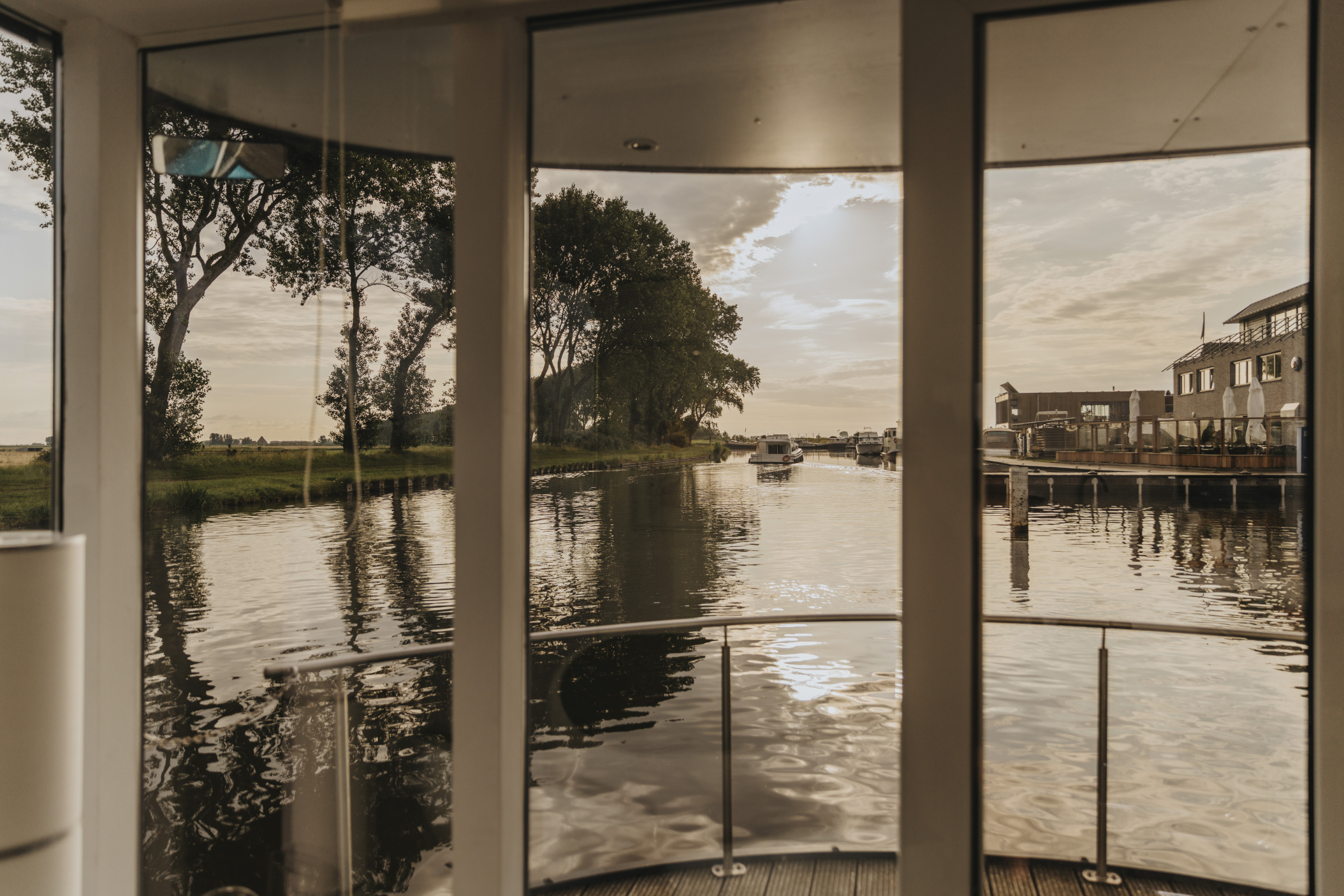 Sunset as seen from a house boat at a channel, Nieuwpoort, Belgium