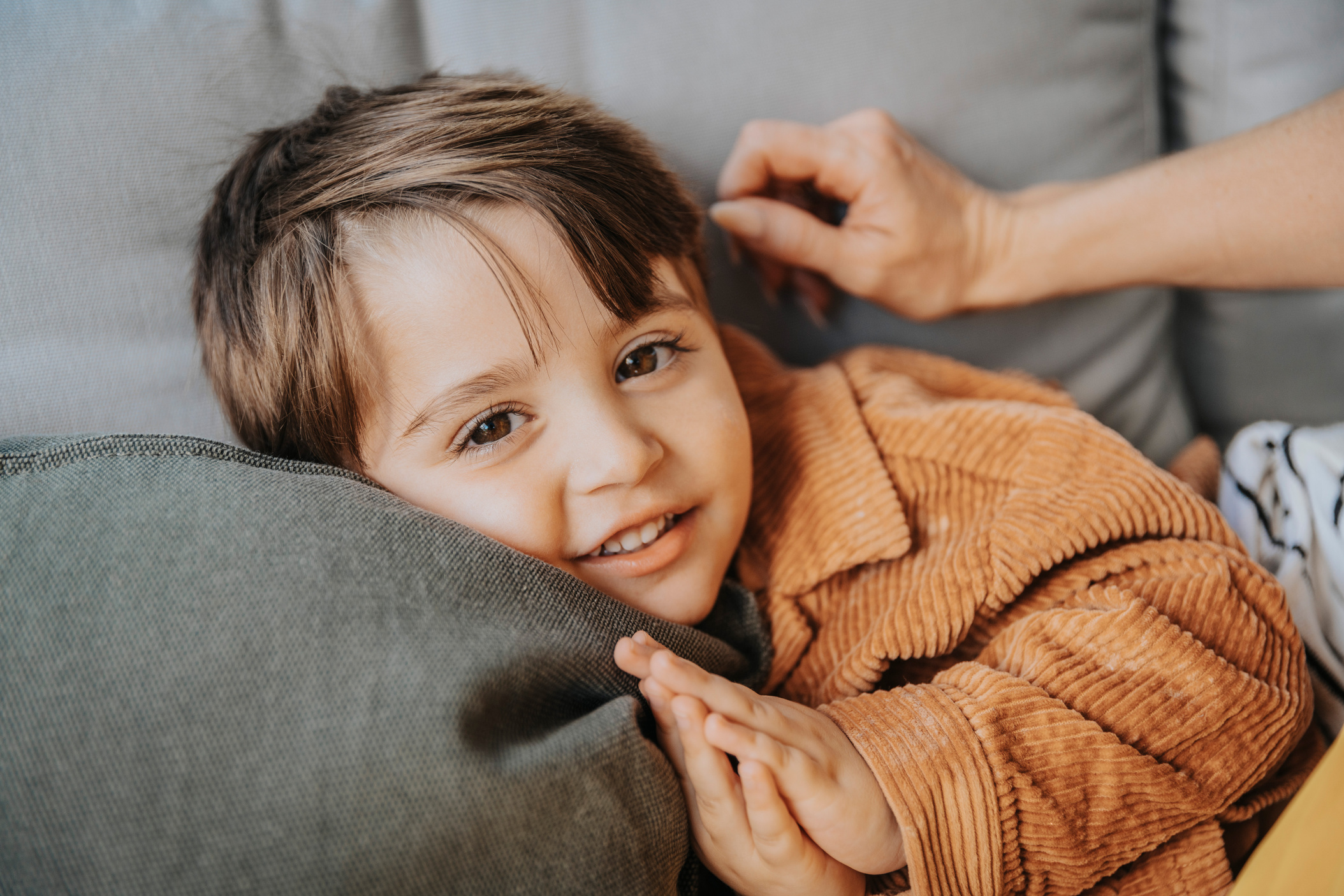 Close-up of cute boy on couch, Cologne, NRW, Germany