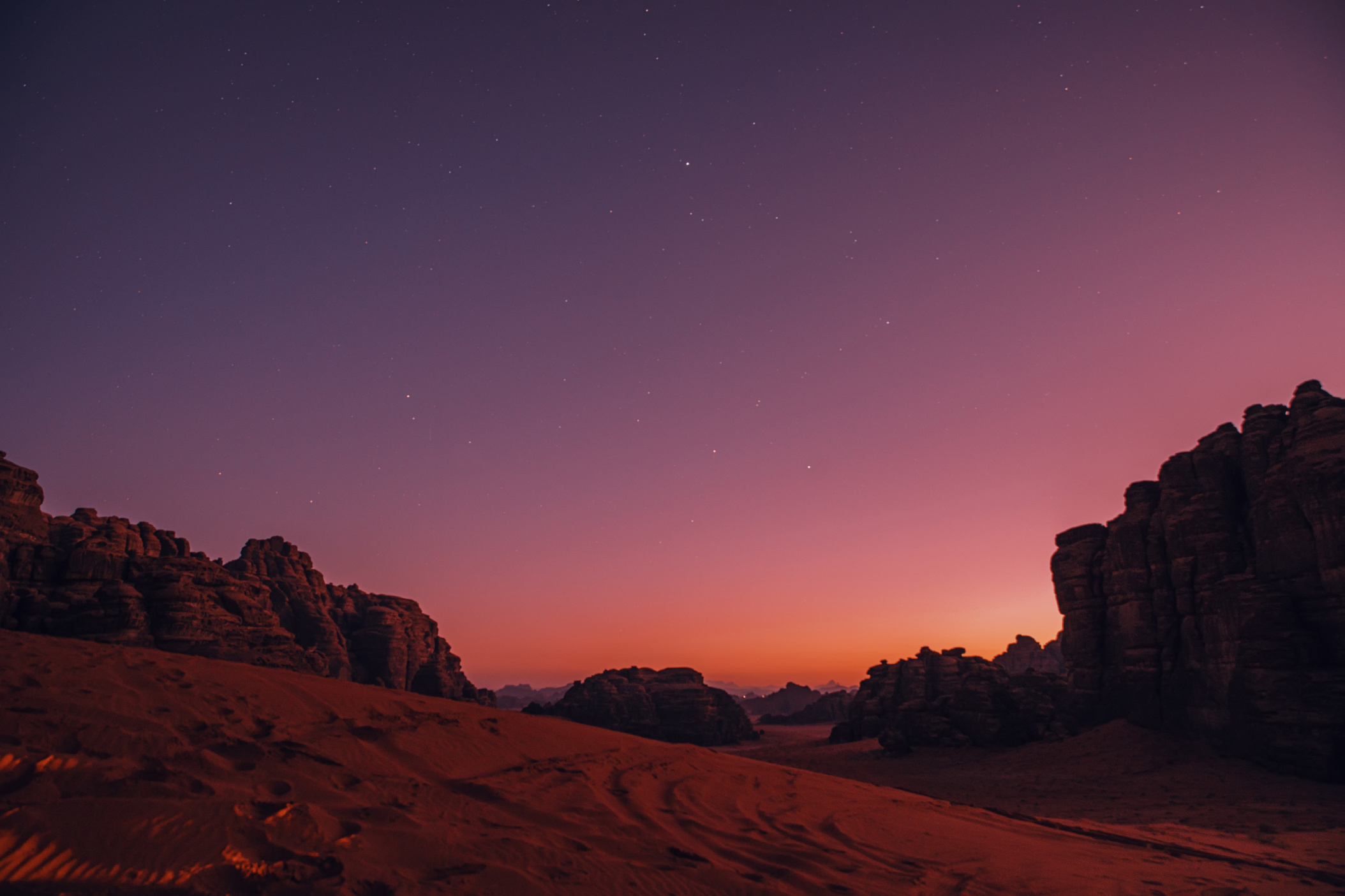 NEOM, SAUDI ARABIA – DECEMBER 10: Starry sky as seen from dune in Hisma Desert during sunset on December 10, 2022, in NEOM, Saudi Arabia.