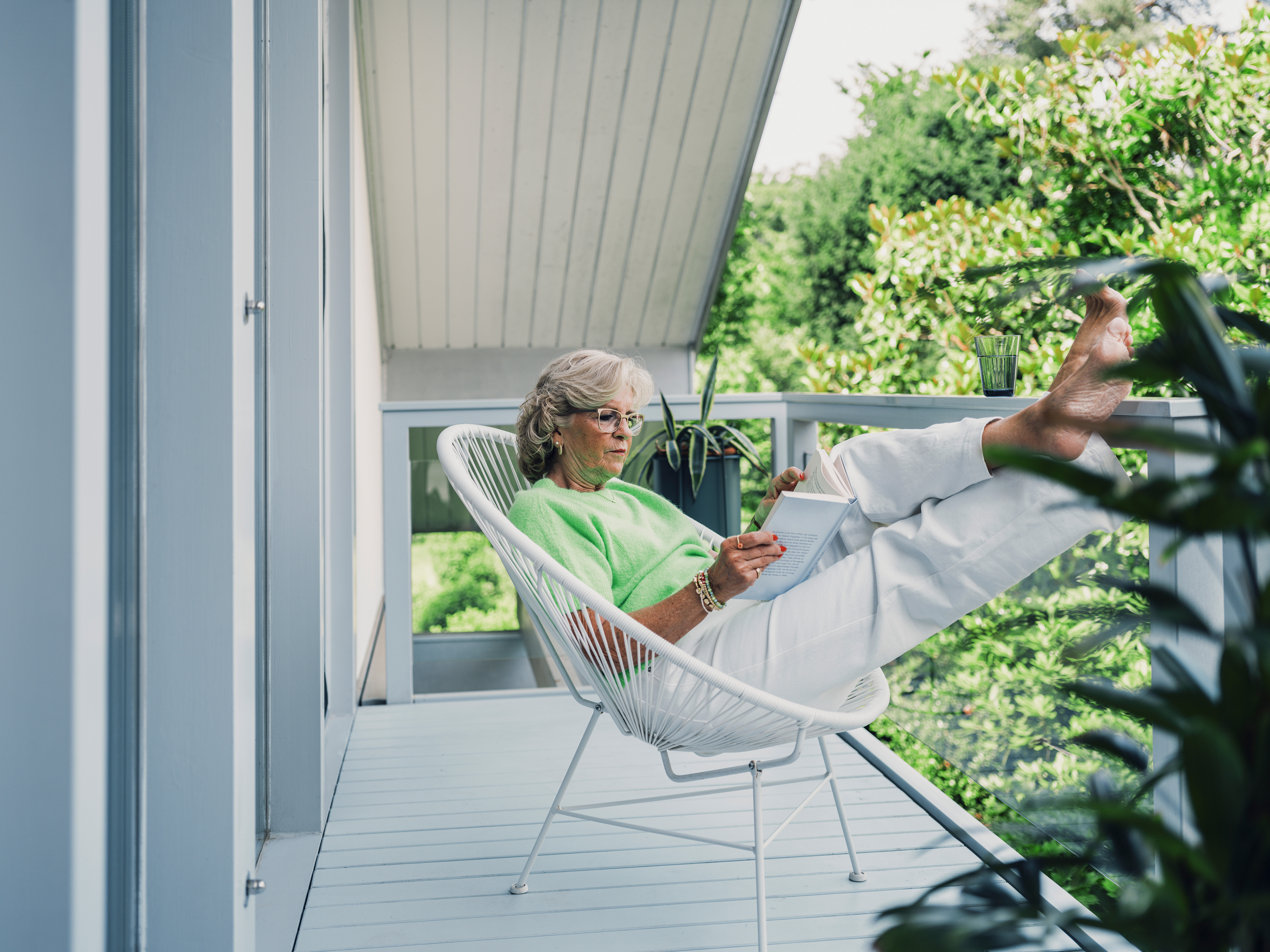 senior, woman, house, balcony, summer, leisure, freetime, reading book, chair, white